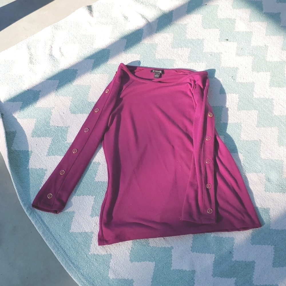 BY design red violet sweater with gold button detail down arms.